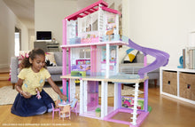 Load image into Gallery viewer, The Barbie Dreamhouse is quite literally every little girls dream! with 3 floors, 8 rooms, fully furnished, with 70 + accessories.  The Dreamhouse has an outdoor area, a rooftop pool with a slide, a working lift big enough for 4 Barbie's.