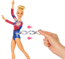 Load image into Gallery viewer, Barbie! You can be ANYTHING! with this set you can be a gymnast! Barbie can tumble, twist and turn with the balance beam and 15 + accessories, pretend you have won the Olympics and win trophies and medals, all included in the Barbie Gymnast set.  Barbie is wearing a colourful metallic leotard and she can do an outfit change with the extra outfits included with the se