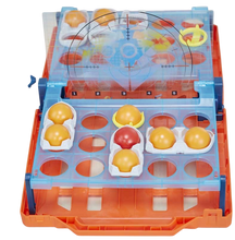 Load image into Gallery viewer, Bounce 'em in to sink and win! The Battleship Shots game presents a ball-tossing twist to Battleship game play. It's head-to-head competition, strategy, and excitement as players get on their feet and bounce or toss their balls over the divider to land them inside their opponent's ships! Players can amp up the suspense when they go for an immediate win by getting the red ball into their opponent's life raft. No ship is safe in this game of stealth and suspense, so position ships strategically to survive an