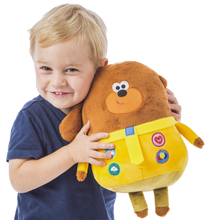 Load image into Gallery viewer, Hey Duggee Hug n Woof is the super fun interactive toy for your little one, press the badges to hear music and sounds, you child will be taking this cuddly toy everywhere with them.