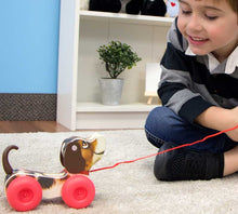 Load image into Gallery viewer, Little Snoopy originally introduced in 1966, Little Snoopy wobbled, wagged and yipped into kids and parents hearts as a beloved Fisher-Price classic toy.  Pull the cord to watch Little Snoopy wobble around and swing his ears.  He also makes a "yip-yip" sound as he moves.  Little Snoopy will be bringing a smile to a new generation.