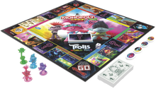 Load image into Gallery viewer, Everybody loves the traditional game of Monopoly, well now your little ones can enjoy it too, with Monopoly Junior the Trolls World Tour Edition.  Your child can play with the much loved characters from the movie, Poppy, Branch, Queen Barb and Cooper, learn to earn with your favourite Trolls, Count and collect the most tiny diamond cash to win!