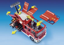 Load image into Gallery viewer, The Playmobil 9464 City Action Fire Engine is ready for any emergency call.  The vehicle features lights and siren sounds for realistic play as well as a removable roof for easier access to the interior.  
