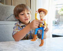 Load image into Gallery viewer, Woody is brought to life! This fantastic loveable Pixar character has 15+sounds and phrases for your little ones to enjoy and pretend they are to in the movie Toy Story! Re-live your favourite movie moments with this fully articulated talking figure!