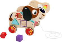 Load image into Gallery viewer, This adorable wooden pull along dog, will give your child hours of fun, this wonderful floopy eared friend is more than just a toy, your child can learn all about colours and shapes through play, this pup will keep your child entertained and educated.
